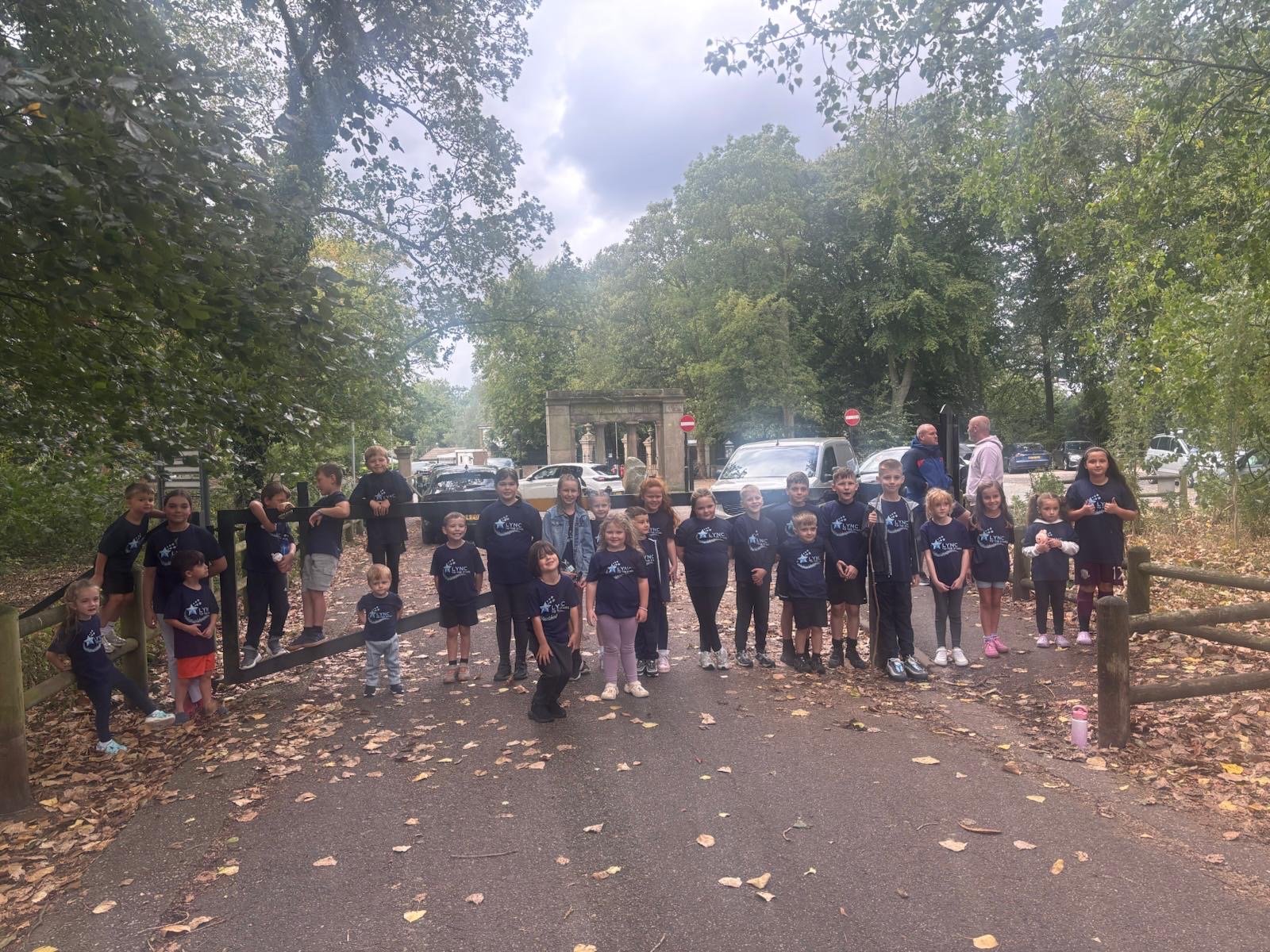 Children gathering together near the park entrance before setting off