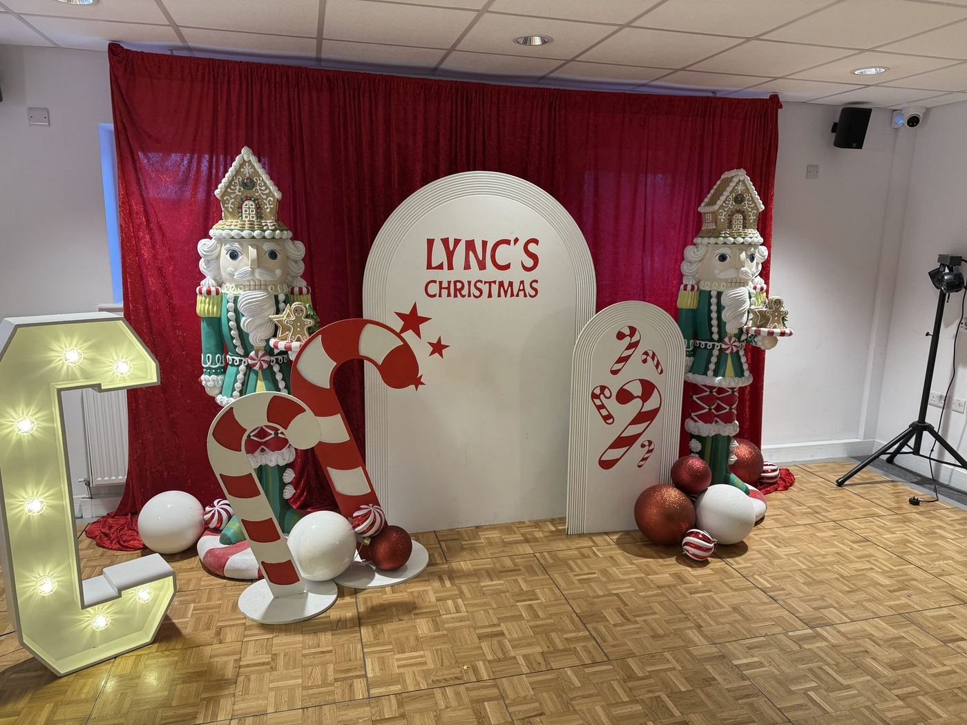 The Lync's Christmas backdrop with candy canes and nutcrackers