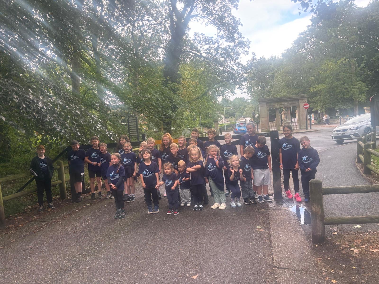Children gathered outdoors in the sunshine on a meet-up Sunday