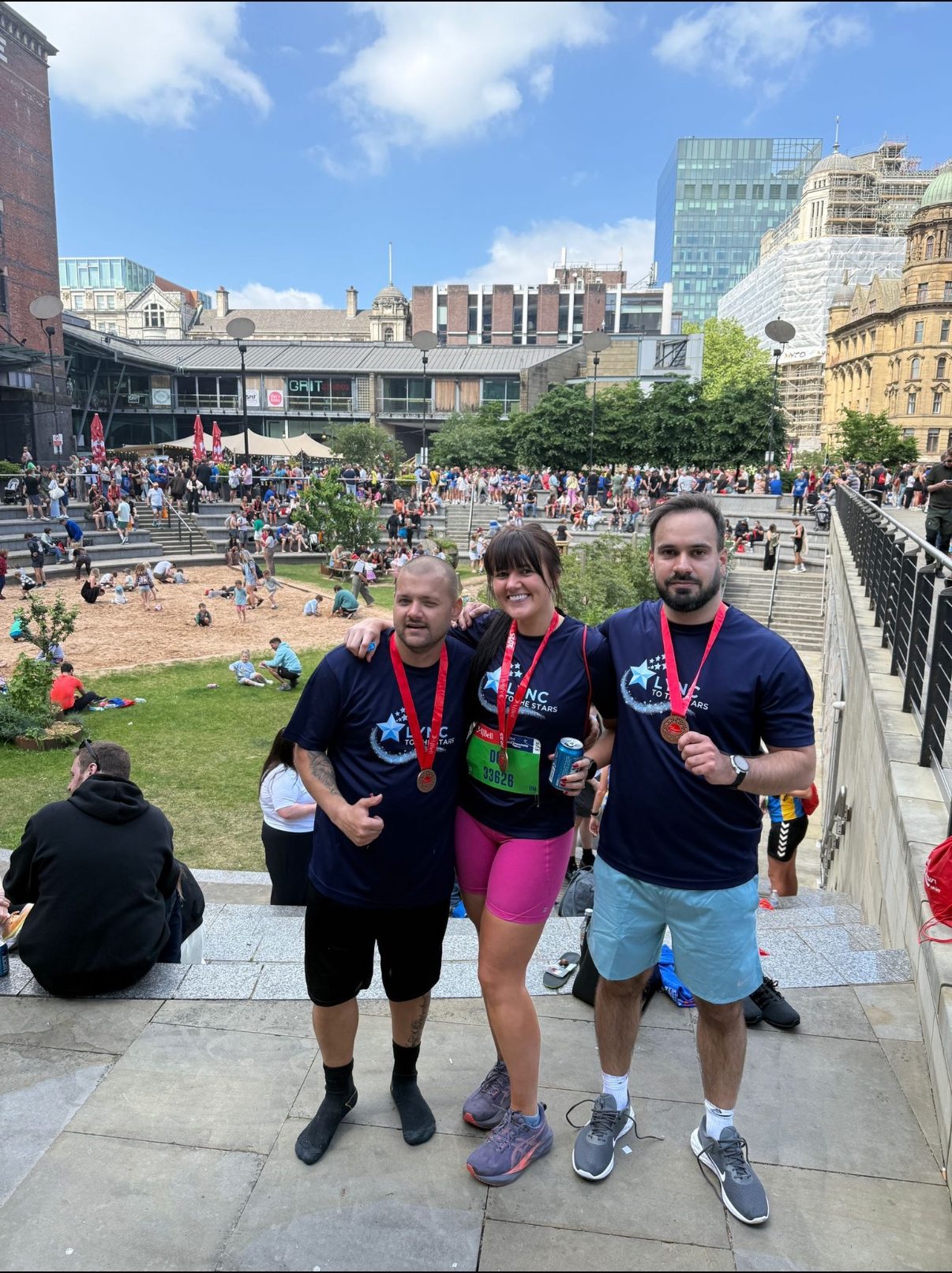 Lee and two friends with their half marathon medals