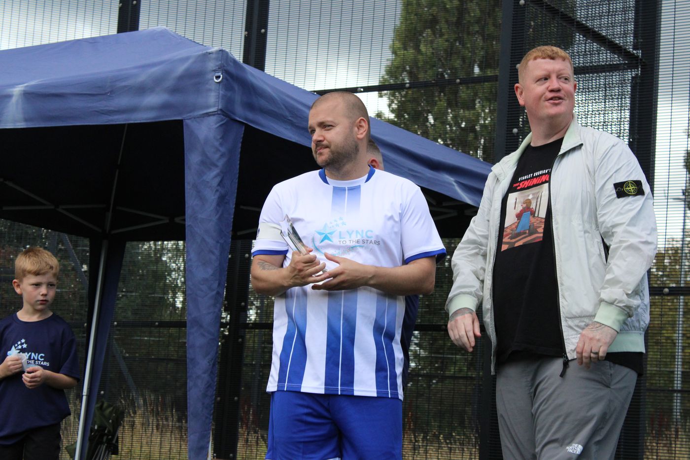 A trophy being presented under the gazebo