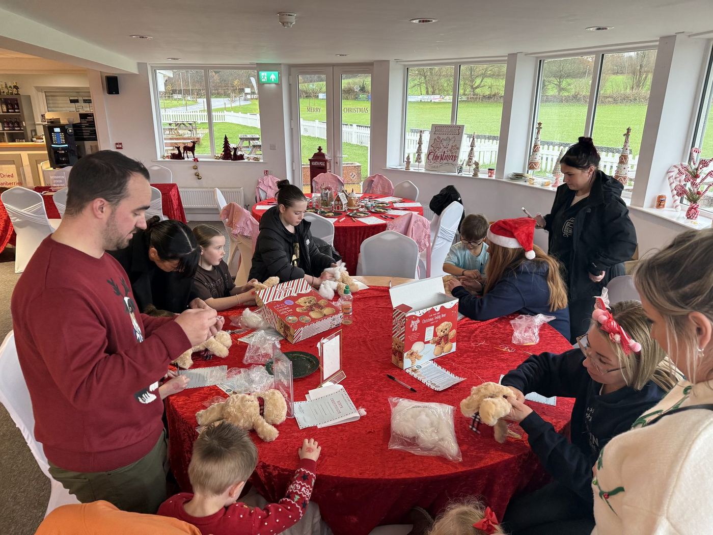 Children and grown-ups making Christmas crafts together