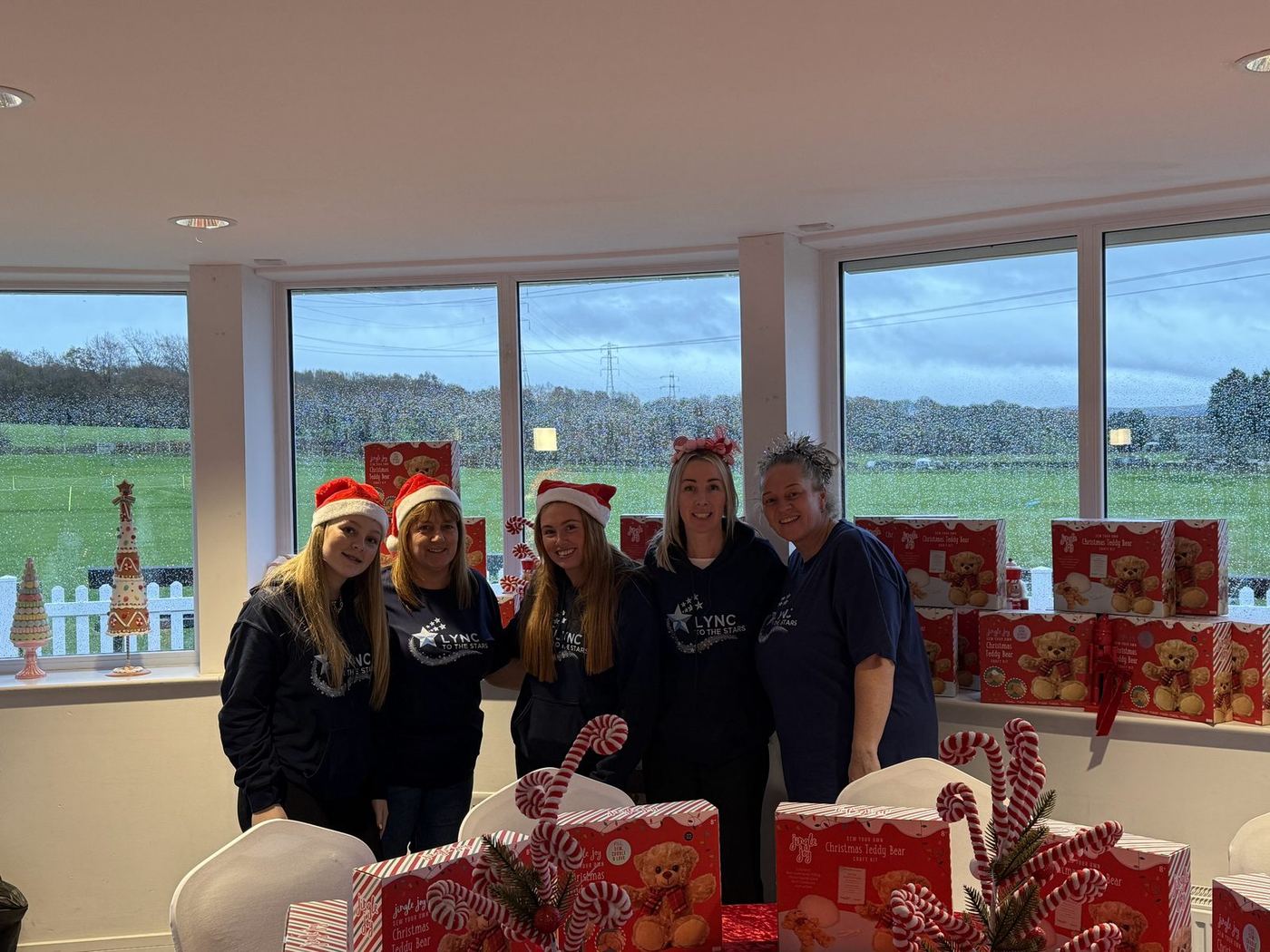 The team in Santa hats ready to welcome everyone
