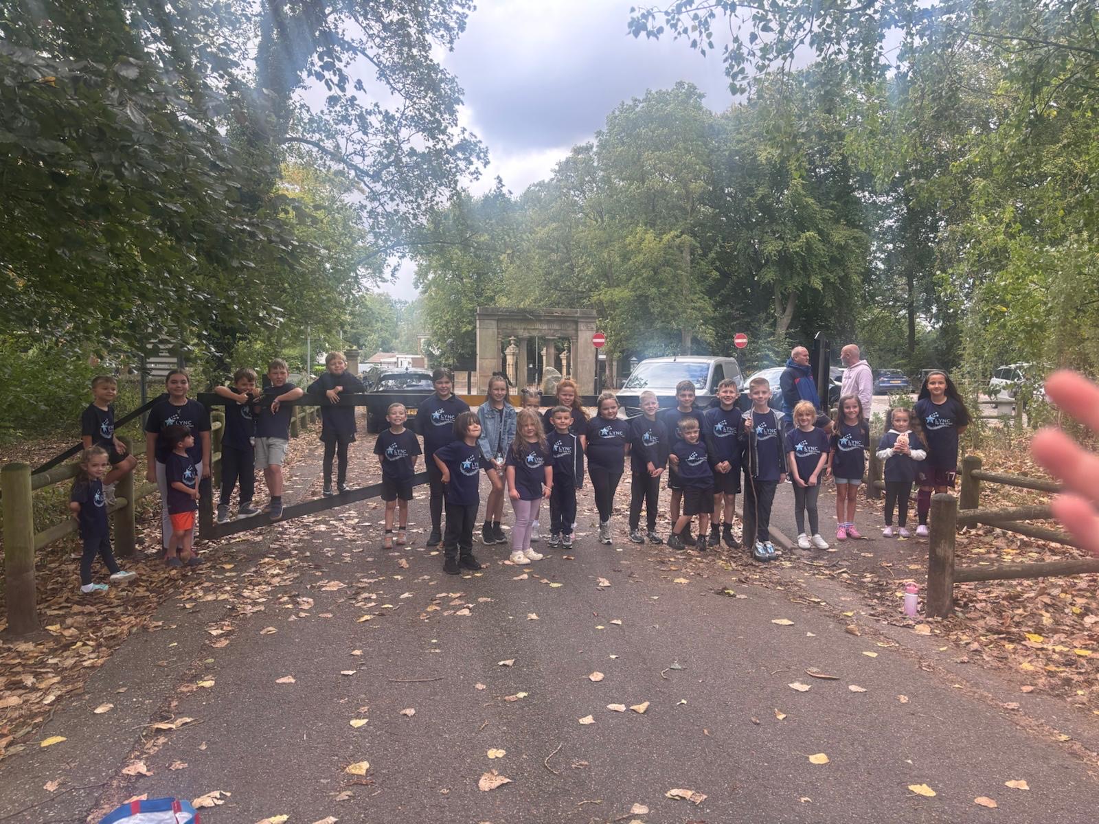 The group all together in their Lync to the Stars shirts