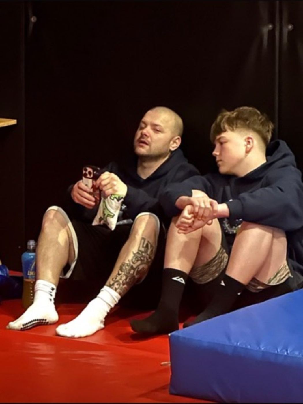 Lee and a friend resting after the challenge