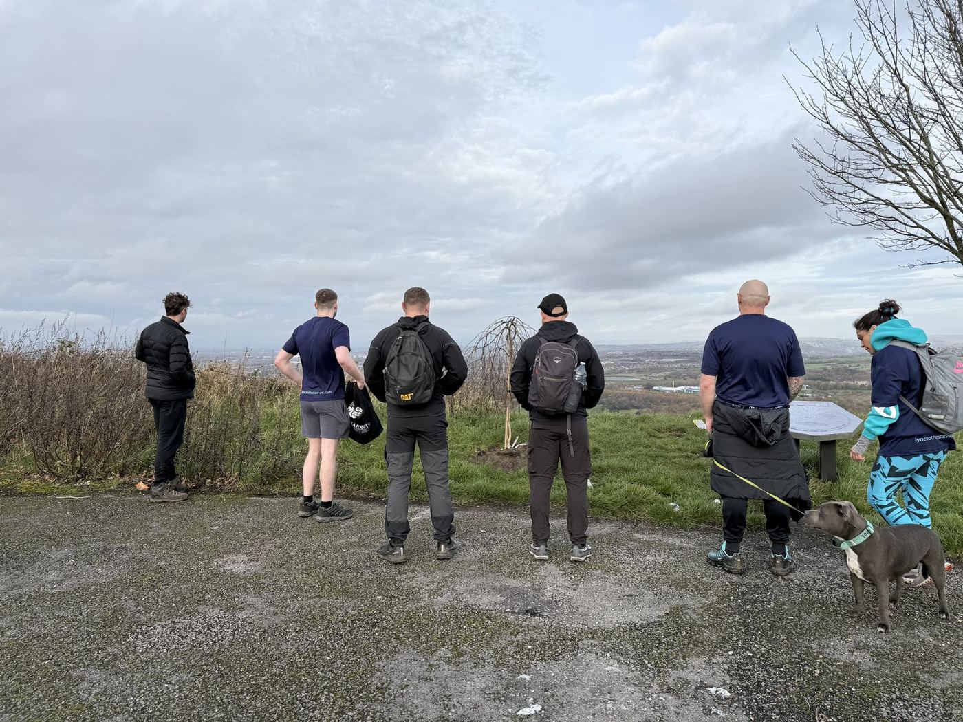 A group of friends walking up to visit Lync's Tree